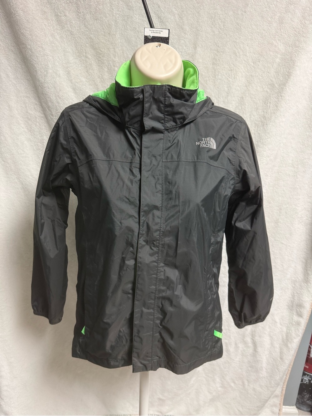 The North Face Kids Black Raincoat with Neon Green Lining